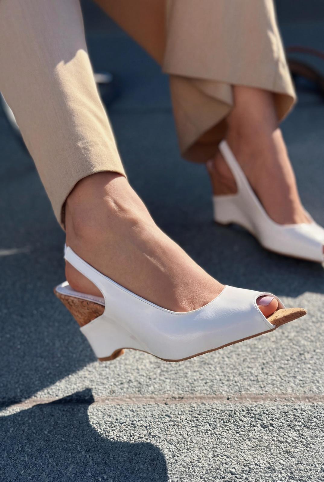 Nerov White crinkled faux leather women's wedge heel sandals